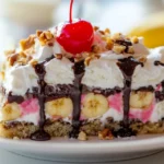Banana Split Cake Recipe: A Sweet, No-Bake Delight for Any Occasion 9 Slice of banana split cake with layers.