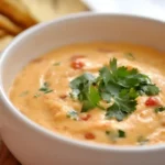 Smoked Queso Recipe: A Deliciously Creamy Dip for Any Occasion 13 Queso with cilantro and chips.