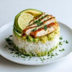 Honey Lime Chicken & Avocado Rice Stack — A Flavorful, Fresh & Healthy Recipe 9 Honey Lime Chicken & Avocado Rice Stack served on jasmine rice with lime wedges and cilantro garnish